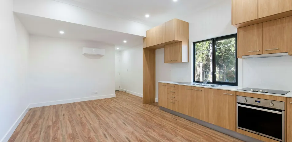 Bare room with hardwood floor installed in San Antonio, TX