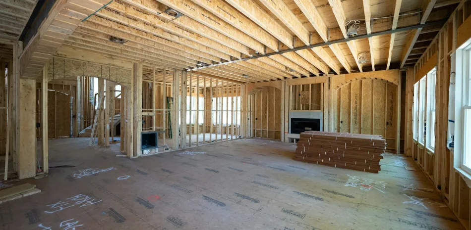 Bare wooden structure of a home under construction in San Antonio, TX
